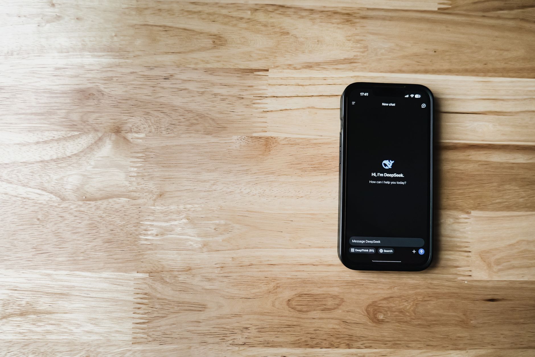 A customer support chat window open on a smartphone showing an AI agent reply