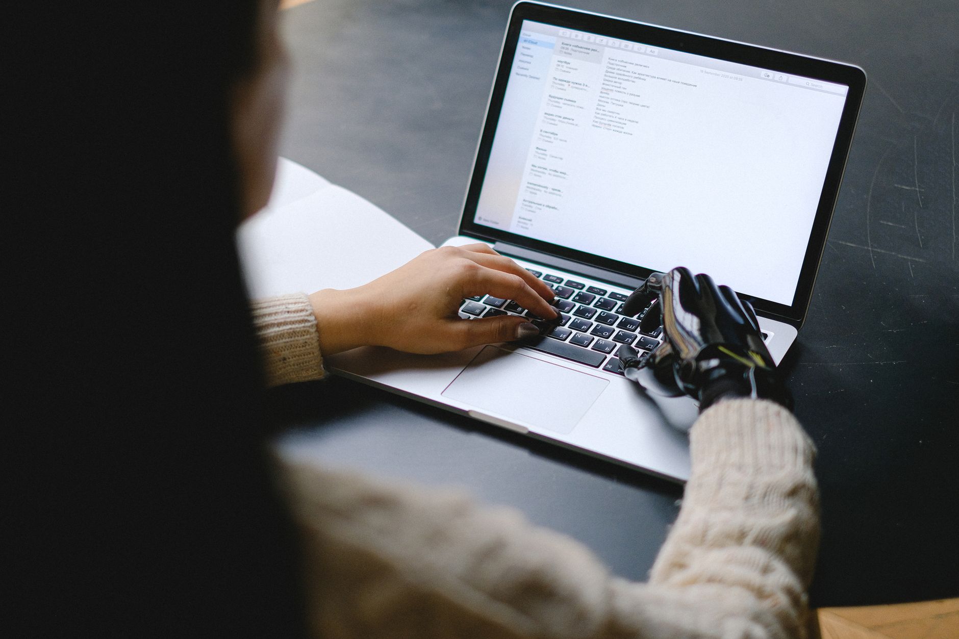 A person reviewing AI generated customer support replies on a laptop screen