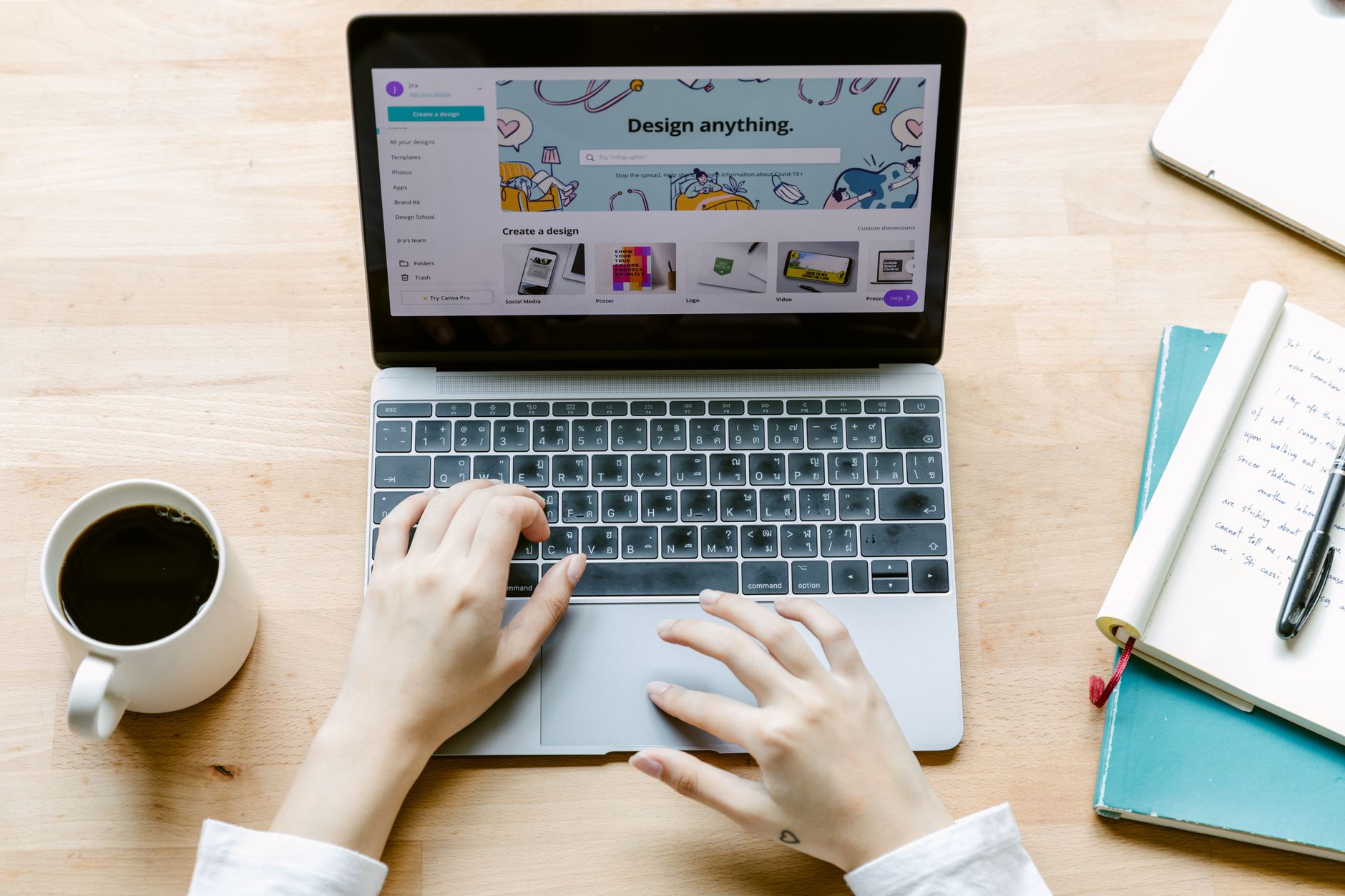 Freelancer arranging a color-coded Instagram content calendar on a laptop at a bright desk with a smartphone nearby